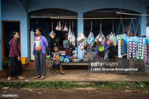 Local villagers are seen at a general store in Nakasong village by the Mekong River on August 26, 2022 in Si Phan Don, Laos. Laos is unique in...