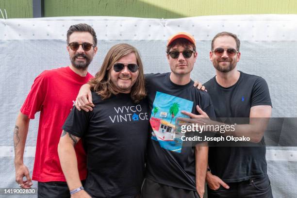 Kyle Simmons, Chris Wood, Dan Smith and Will Farquarson of Bastille pose backstage during Reading Festival day 3 on August 28, 2022 in Reading,...