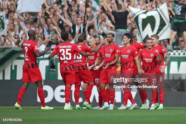 Mario Goetze and his teammates of Eintracht Frankfurt celebrate after scoring their side's first goal during the Bundesliga match between SV Werder...