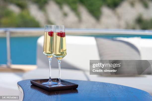 cocktail glasses on table - yacht stock pictures, royalty-free photos & images