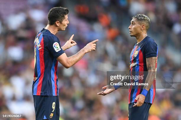 Robert Lewandowski of FC Barcelona gives instructions to his team mate Rafinha during the La Liga Santander match between FC Barcelona and Real...