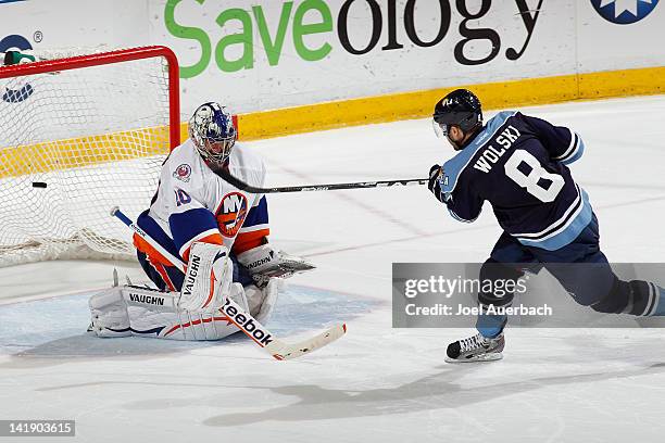 Wojtek Wolski of the Florida Panthers has his shot deflected by Goaltender Evgeni Nabokov of the New York Islanders during the shoot out on March 25,...