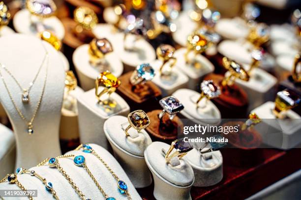 rings, earrings, bracelets and other for sale, grand bazaar, istanbul, turkey - rhinestone stockfoto's en -beelden