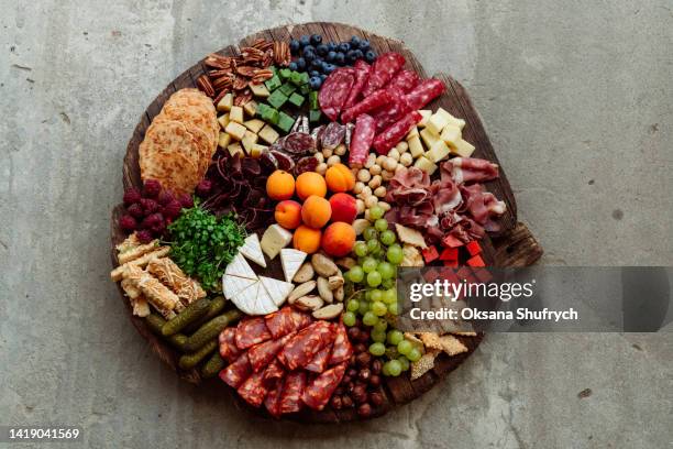 gathering plate - cheese and salami snacks - chopping board from above stock pictures, royalty-free photos & images