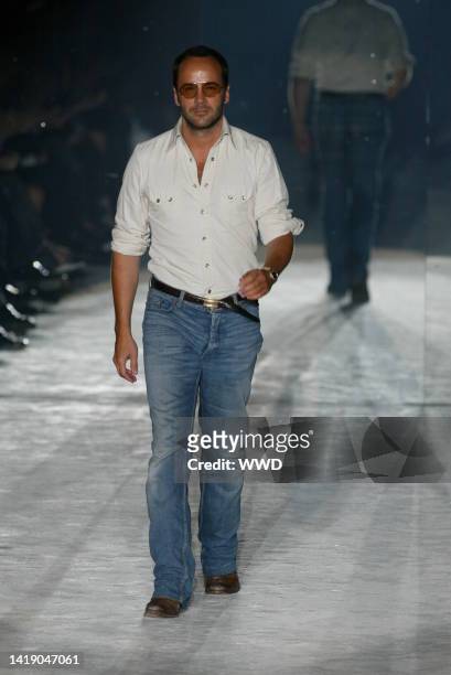 Designer Tom Ford walks down the runway at the Spring 2004 Gucci show in Milan.