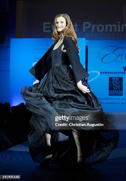 Karina Krawczyk shows designs on the catwalk during the charity event "Event Prominent" at the Hotel Grand Elysee on March 25, 2012 in Hamburg,...