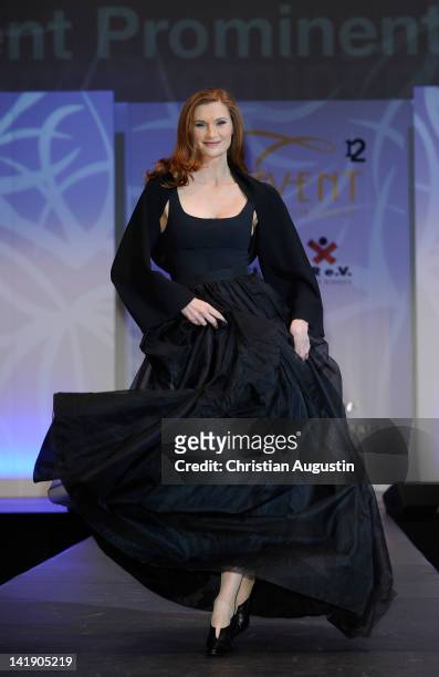 Karina Krawczyk shows designs on the catwalk during the charity event "Event Prominent" at the Hotel Grand Elysee on March 25, 2012 in Hamburg,...
