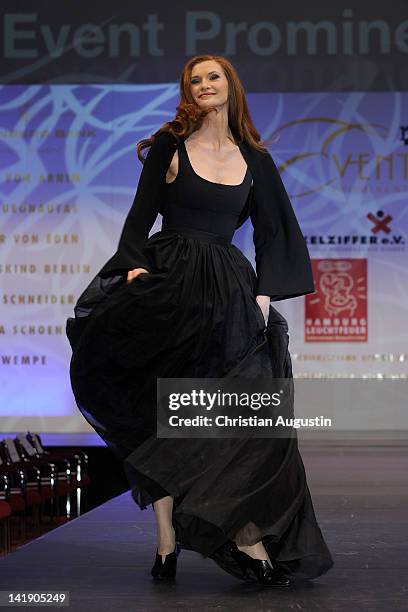 Karina Krawczyk shows designs on the catwalk during the charity event "Event Prominent" at the Hotel Grand Elysee on March 25, 2012 in Hamburg,...