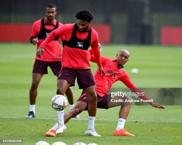 Fabinho and Joe Gomez of Liverpool during a training session at AXA Training Centre on August 29, 2022 in Kirkby, England.