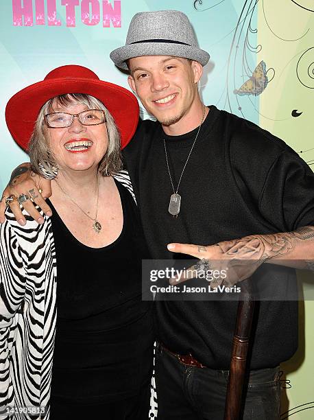 Singer Chris Rene and guest attend Perez Hilton's Mad Hatter tea party birthday celebration on March 24, 2012 in Los Angeles, California.