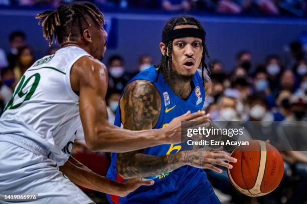 Jordan Clarkson of Team Philippines competes against Musab Tariq M Kadi of Team Saudi Arabia during the FIBA World Cup Asian Qualifier Group E...