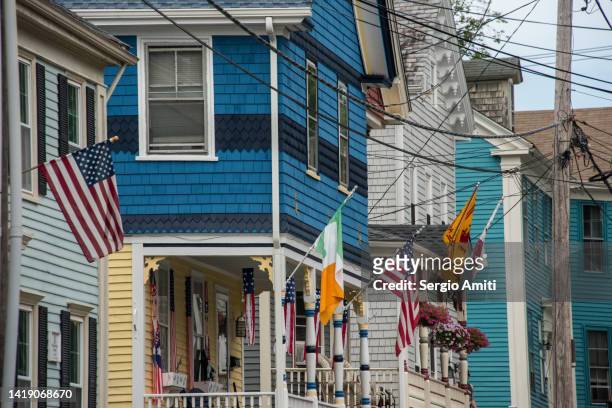 row of colourful traditional houses with irish and american flags in newport, rhode island - rhode island sign stock pictures, royalty-free photos & images
