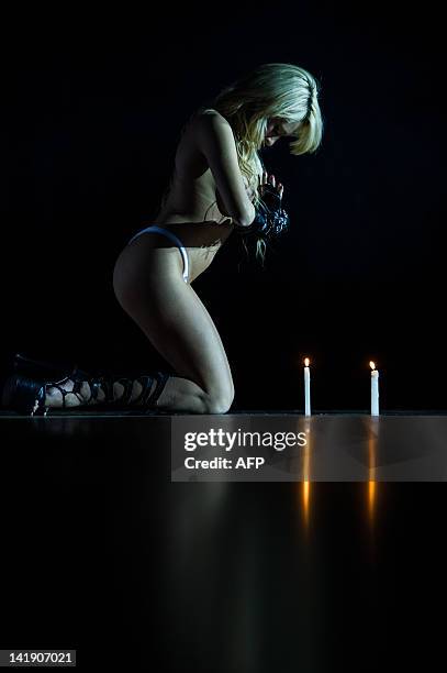 Dancer performs a strip dance during the "Erotika Fair" in Sao Paulo, Brazil on March 25, 2012. The annual fair of products and services for the...