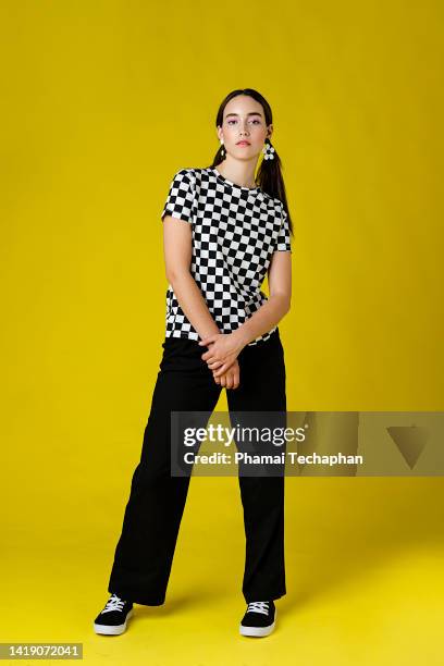 stylish woman in front of plain background - fashionable girl stock pictures, royalty-free photos & images