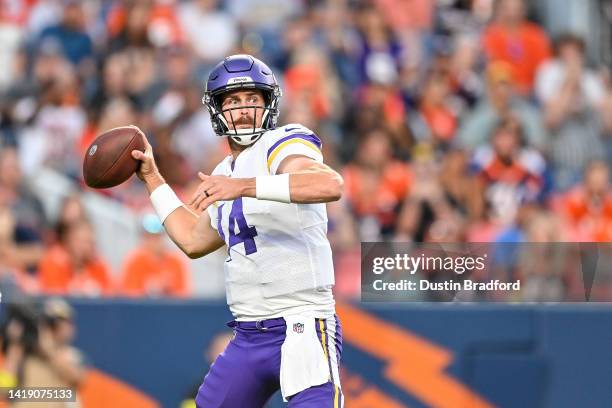Quarterback Sean Mannion of the Minnesota Vikings passes against the Denver Broncos in the first quarter of a preseason NFL game at Empower Field at...