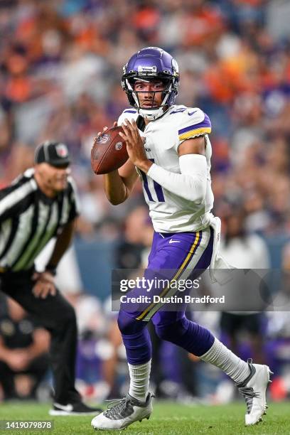 Quarterback Kellen Mond of the Minnesota Vikings looks to pass against the Denver Broncos in the second half of a preason NFL game at Empower Field...