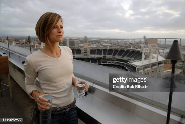 Laura Madden from Scottsdale, Arizona enjoys the views of Petco Stadium, San Diego Bay and Point Loma from the Marriott Hotel 22nd floor outdoor bar...