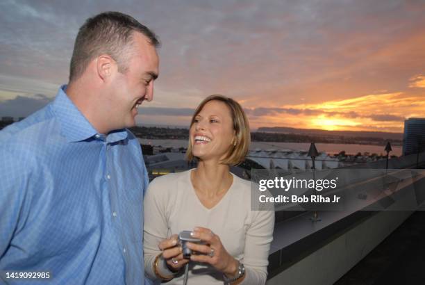 Laura Madden from Scottsdale, Arizona and husband Ed, enjoy the views of Petco Stadium, San Diego Bay and Point Loma from the Marriott Hotel 22nd...