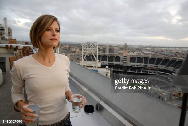 Laura Madden from Scottsdale, Arizona enjoys the views of Petco Stadium, San Diego Bay and Point Loma from the Marriott Hotel 22nd floor outdoor bar...