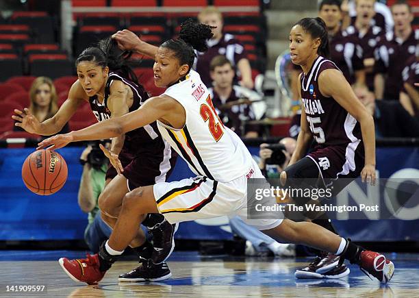 Texas A&amp;M Aggies guard Sydney Carter , left, reaches in to steal the ball from Maryland Terrapins forward Alyssa Thomas during a Regional...