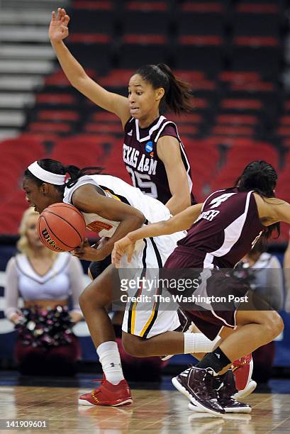 Maryland Terrapins guard Laurin Mincy almost looses the ball as Texas A&amp;M Aggies guard Skylar Collins , top, and Texas A&amp;M Aggies guard...