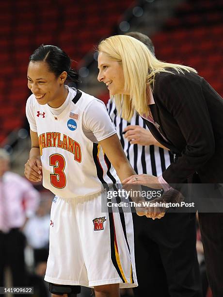 Maryland Terrapins guard Brene Moseley talks with Maryland Terrapins head coach Brenda Frese after Maryland builds up a lead late in the game during...