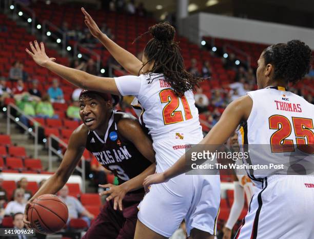 Texas A&amp;M Aggies center Kelsey Bone tries to drive to the basket under Maryland Terrapins forward Tianna Hawkins during a Regional Semifinal game...