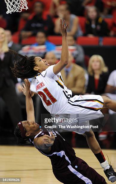 Maryland Terrapins forward Tianna Hawkins falls back towards Texas A&amp;M Aggies center Kelsey Bone on her way to the ground during a Regional...
