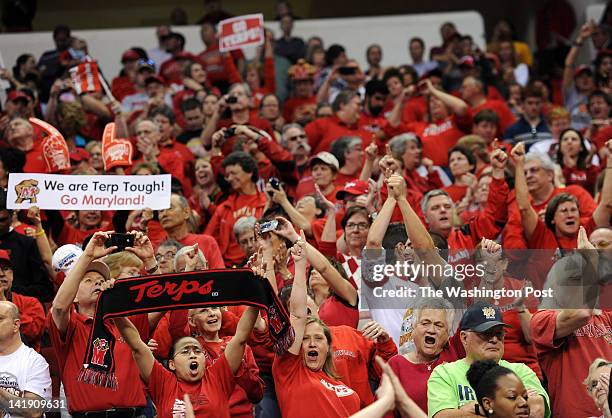 Maryland Terrapin fans cheer after their team defeated the Texas A&amp;M Aggies to win a Regional Semifinal game of the Women's NCAA basketball...