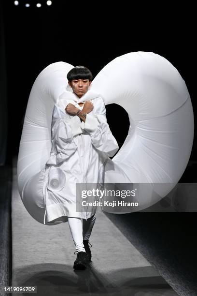 Model showcases designs by yoshiokubo as part of Rakuten Fashion Week TOKYO 2023 spring summer on August 29, 2022 in Tokyo, Japan.