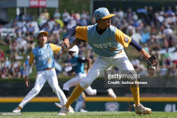 Jaron Lancaster of the West Region team from Honolulu, Hawaii fields a bunt during the first inning of the Little League World Series Championship...