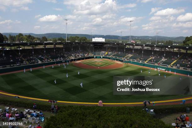 Players warm up before the Little League World Series Championship game between the West Region team from Honolulu, Hawaii and the Caribbean Region...