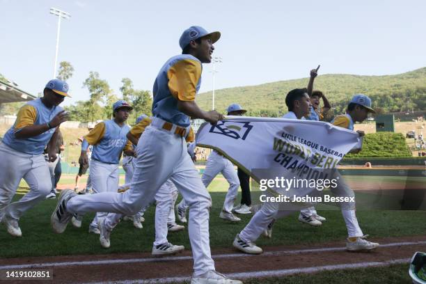 Players from the West Region team from Honolulu, Hawaii celebrate winning the Little League World Series Championship game 13-3 against the Caribbean...