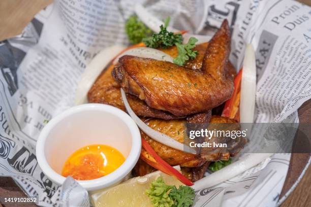 roasted chicken wings on the plate - チキンウィング ストックフォトと画像