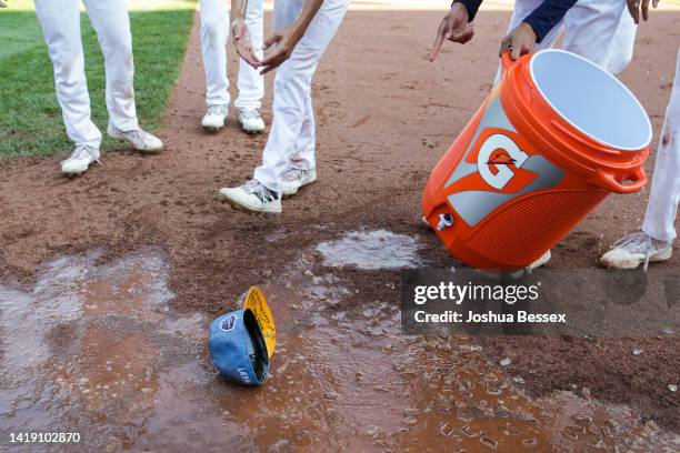 Water-soaked hat lands on the ground as players from the West Region team from Honolulu, Hawaii celebrate winning the Little League World Series...