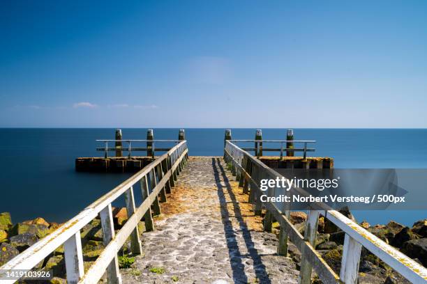 landscape picture of a calm evening in october over the afsluitdijk,afsluitdijk,breezanddijk,netherlands - versteeg stock pictures, royalty-free photos & images