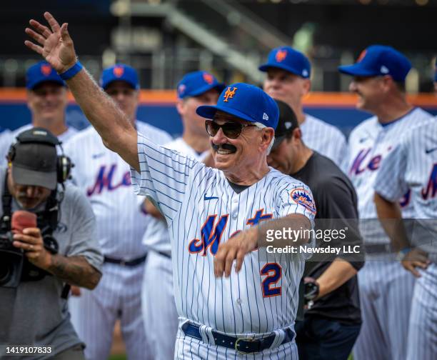 Former NY Mets manager Bobby Valentine waves to the crowd while wearing a fake moustache as he is introduced before the Old Timers Day gall game at...