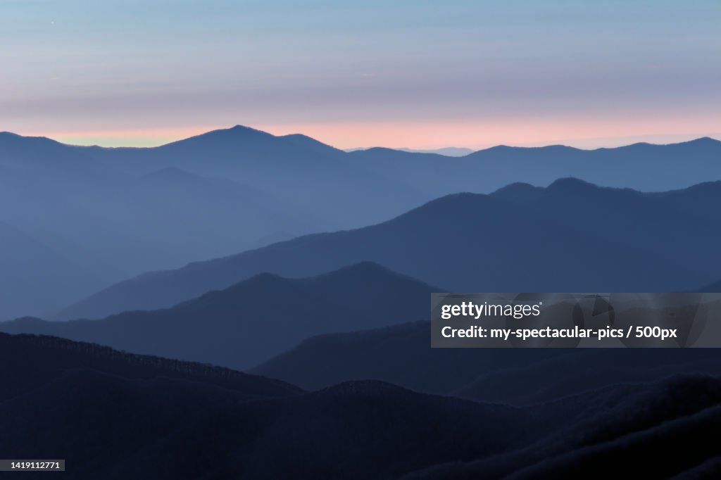 Scenic view of silhouette of mountains against sky during sunset
