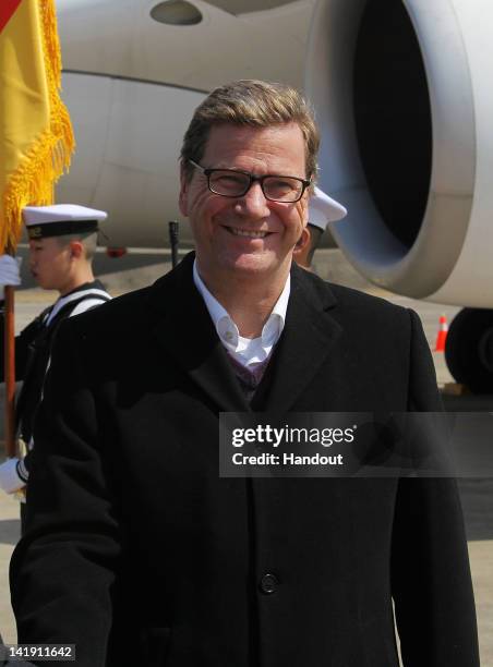 In this handout image provided by Yonhap News, German Foreign Minister Guido Westerwelle arrives at Incheon International Airport to attend the 2012...