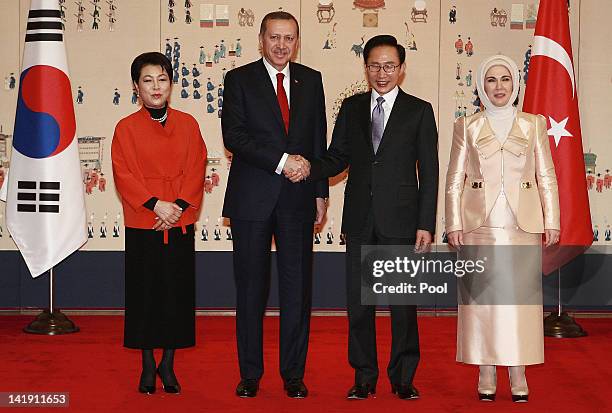 Turkish Prime Minister Recep Tayyip Erdogan and his wife Emine Erdogan , South Korean President Lee Myung- bak and his wife Kim Yoon-ok , pose before...