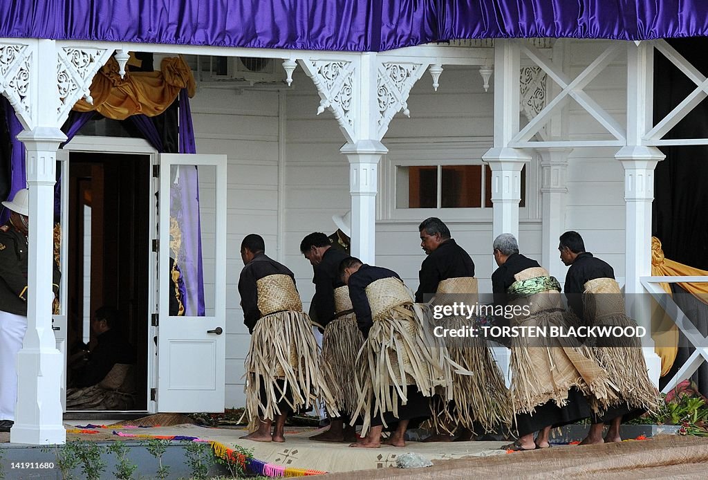 Respect Intonga Tongan elders bow in respect at the entrance to the throne room of ...