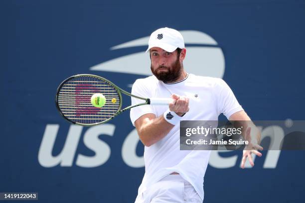 Quentin Halys of France returns a shot against Arthur Rinderknech of France during the Men's Singles First Round on Day One of the 2022 US Open at...