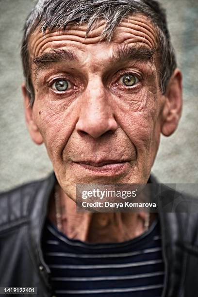 a  portrait of an elderly russian man, a worker, a man with blue eyes. - eastern european descent stock pictures, royalty-free photos & images