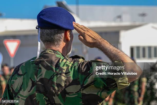 The Chief of Staff of the Navy Admiral Henrique Gouveia e Melo salutes as the national anthem is being played during the welcome ceremony of Marines...