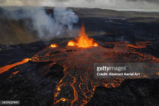 lava violently erupting from an active volcano shot by drone, iceland - volcanic activity fotografías e imágenes de stock