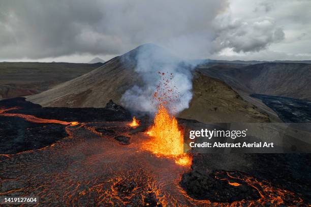 dramatic volcanic eruption photographed from a drone point of view, iceland - active volcano stock pictures, royalty-free photos & images