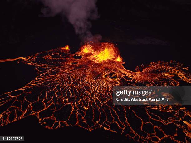 aerial image showing an active volcano at night, iceland - grindavik stock-fotos und bilder