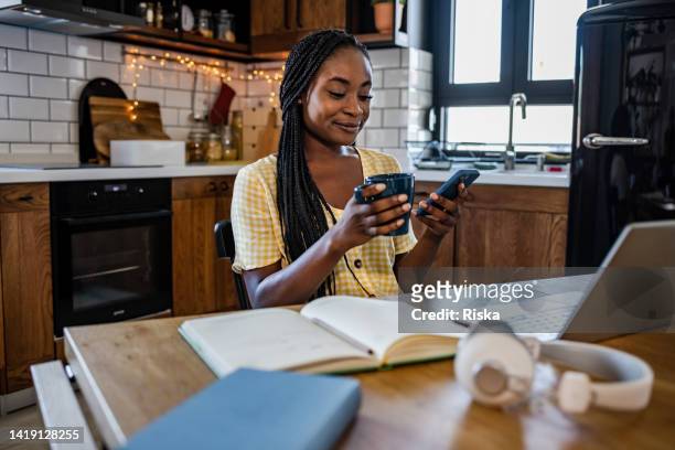 young woman taking a little break from work - scroll stock pictures, royalty-free photos & images