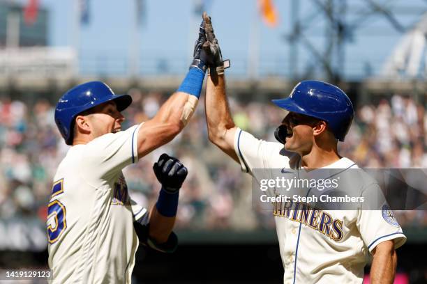 Dylan Moore of the Seattle Mariners reacts after his three run home run with Adam Frazier against the Cleveland Guardians during the fifth inning at...