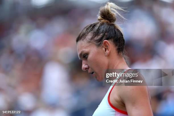 Simona Halep of Romania looks on against Daria Snigur of Ukraine during the Women's Singles First Round on Day One of the 2022 US Open at USTA Billie...